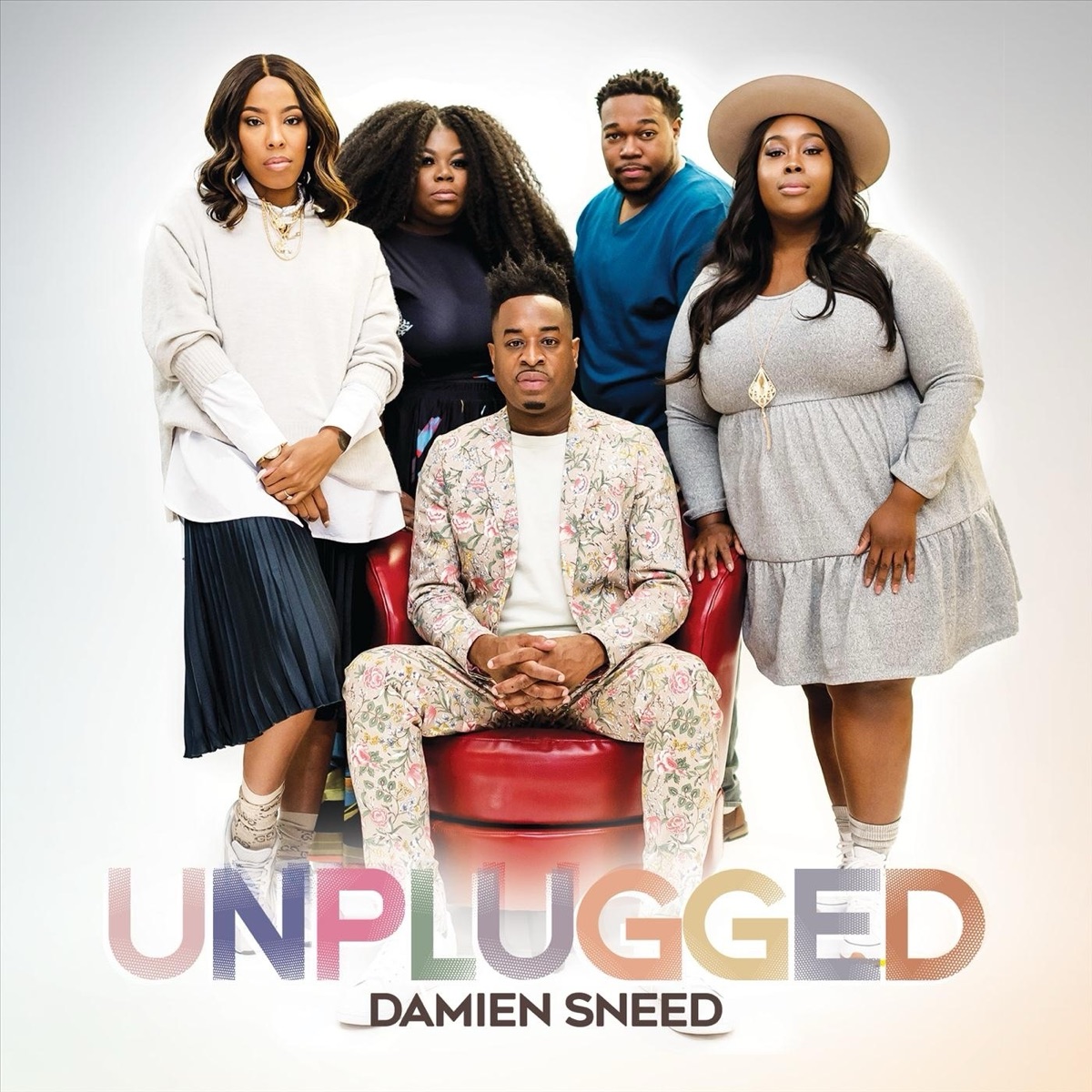 Cover of Damien Sneed UNPLUGGED featuring Sneed seated with four vocalists